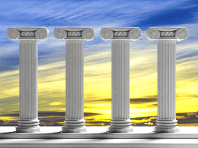 Four pillars standing against a duotone blue and yellow sky
